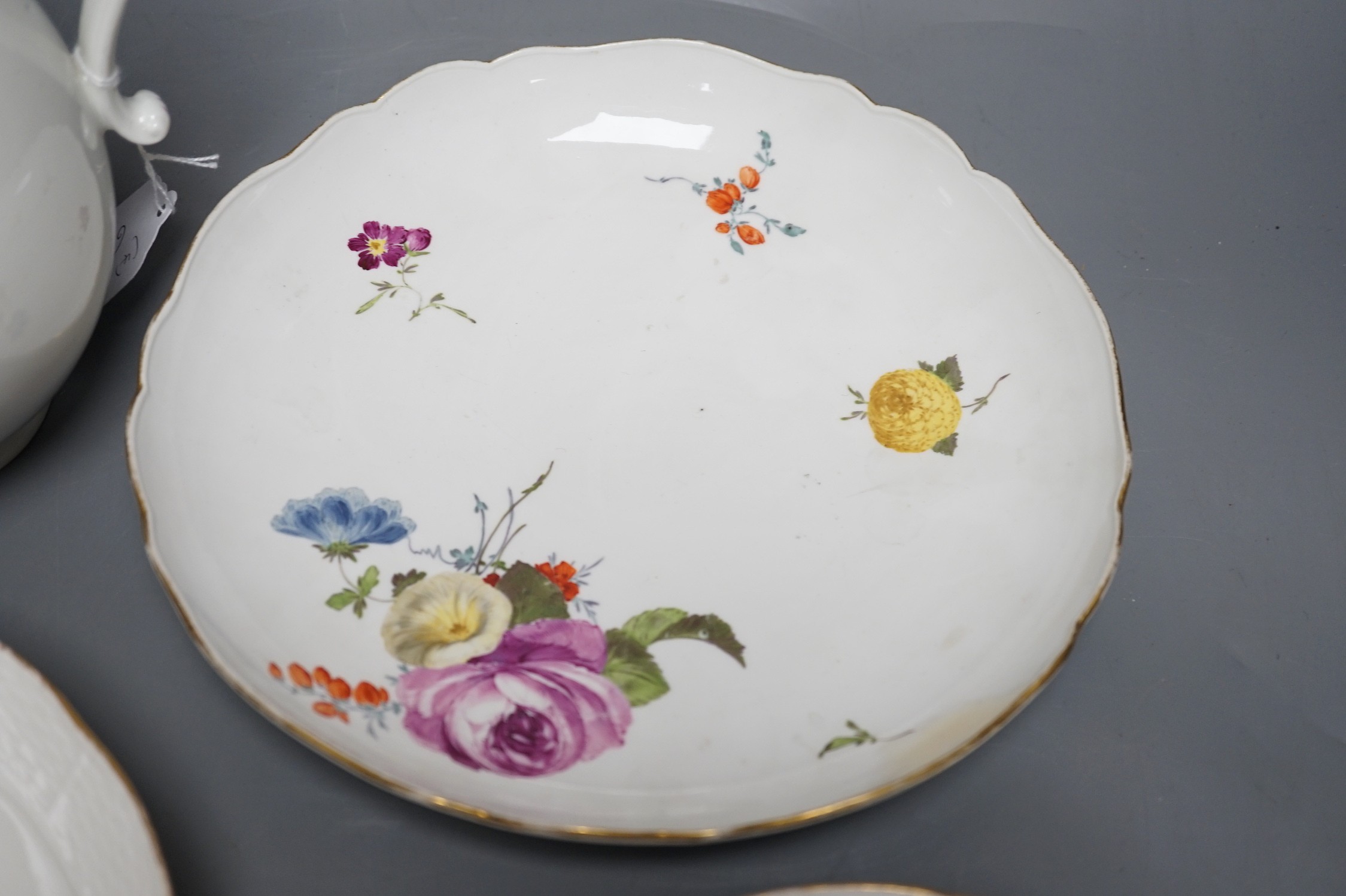 A group of three 18th century Meissen flower painted dishes and a similar late 18th century Vienna ewer, 20cm tall